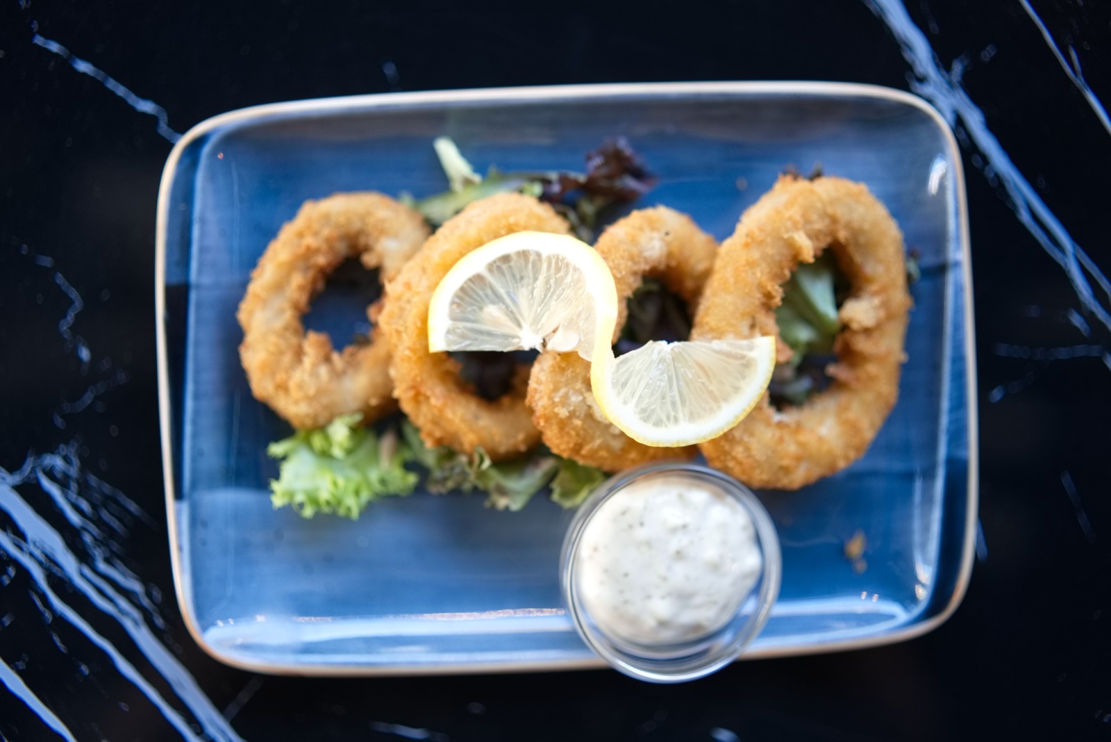 Crispy calamari rings with lemon and tartare sauce