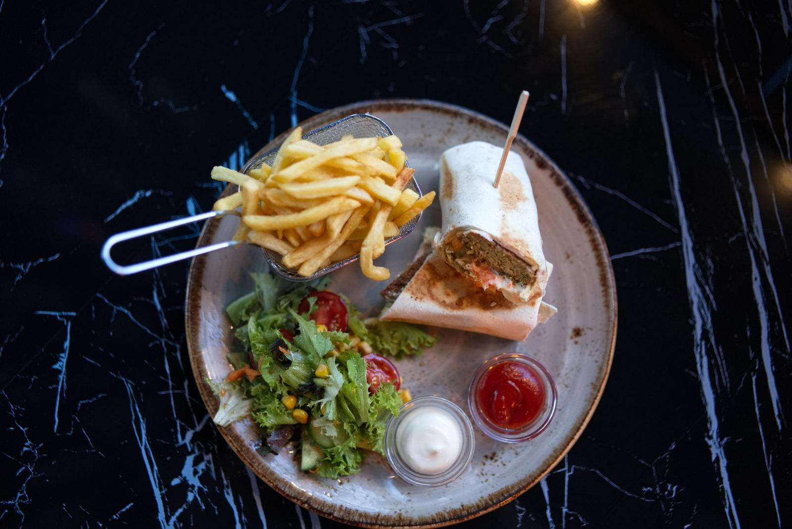 Falafel wrap with fries, salad and dips